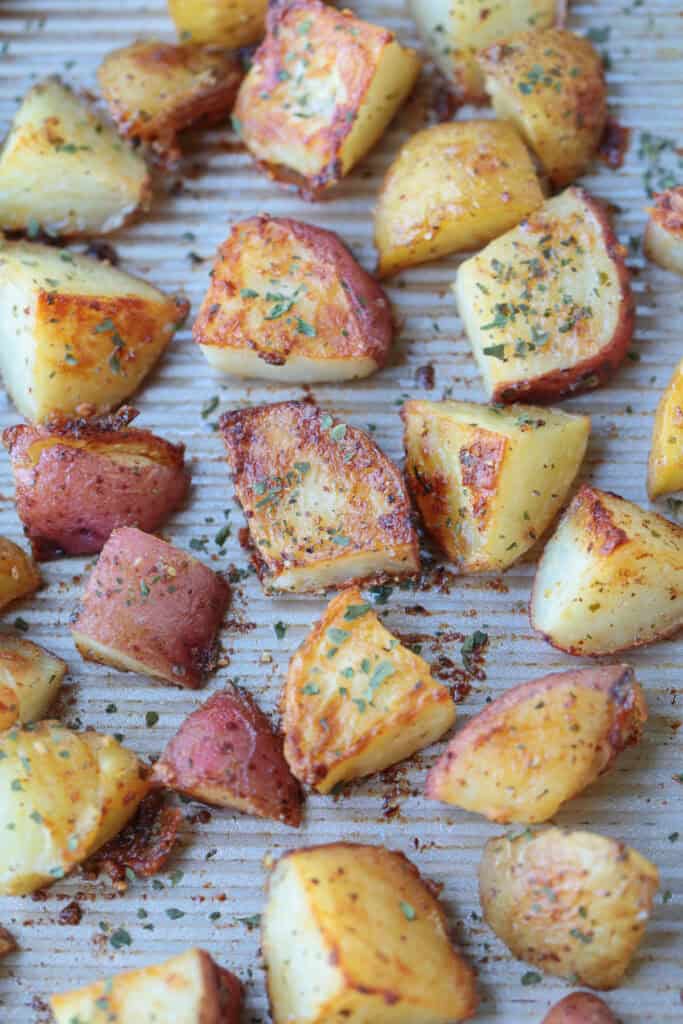 cubed roasted potatoes on baking sheet