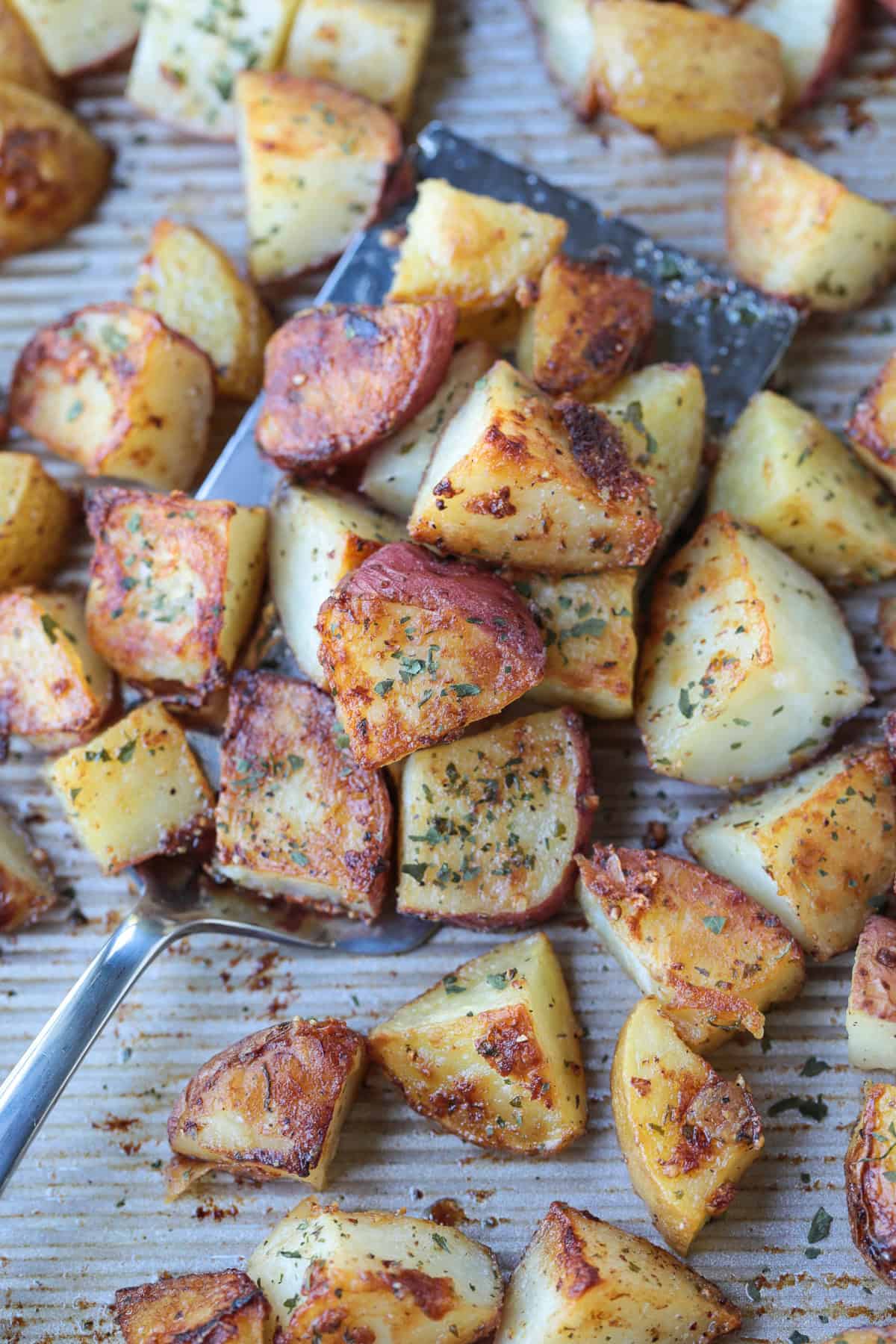 diced roasted potatoes on spatula