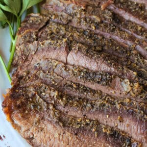 close up of sliced steak on platter