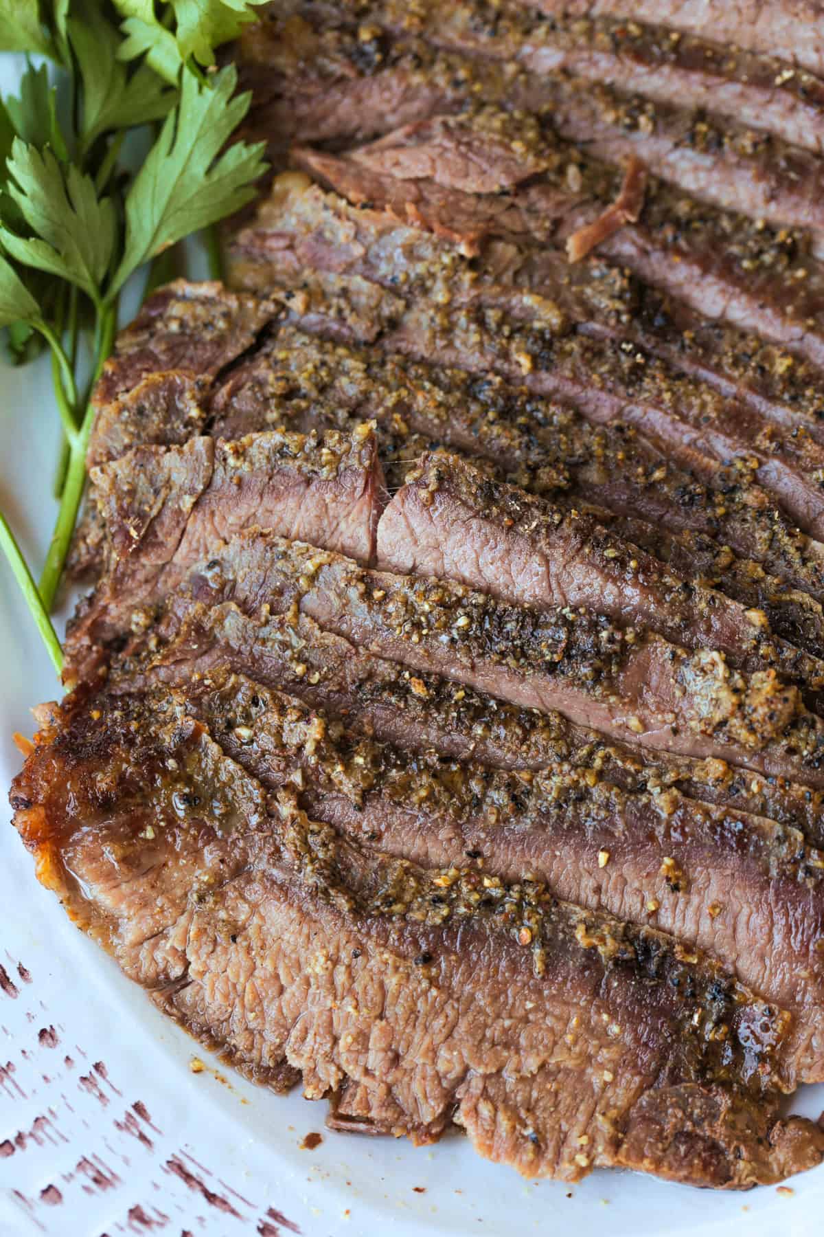 close up of sliced steak on platter