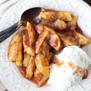 apples with brown sugar and cinnamon on plate with ice cream