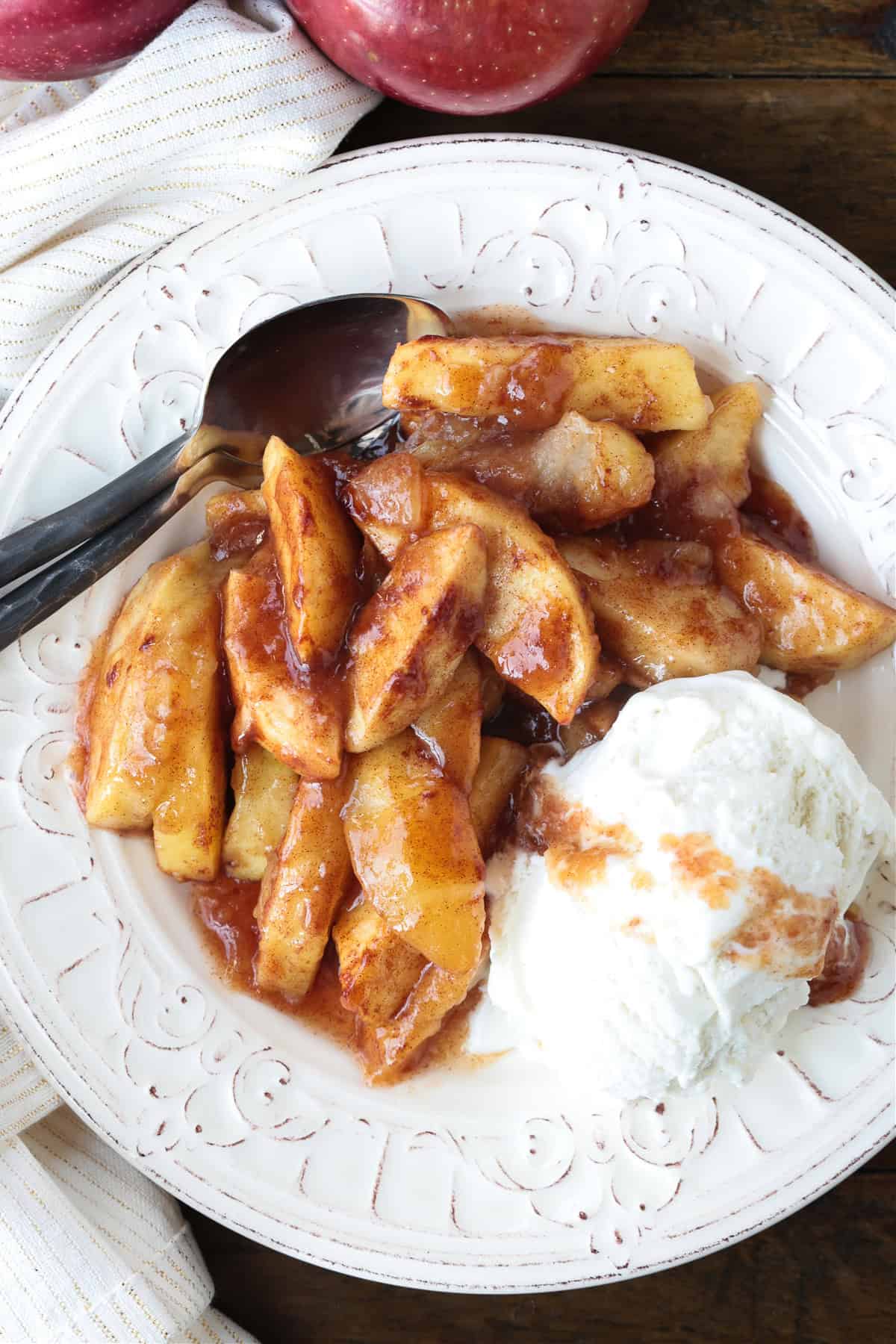 apples with brown sugar and cinnamon on plate with ice cream