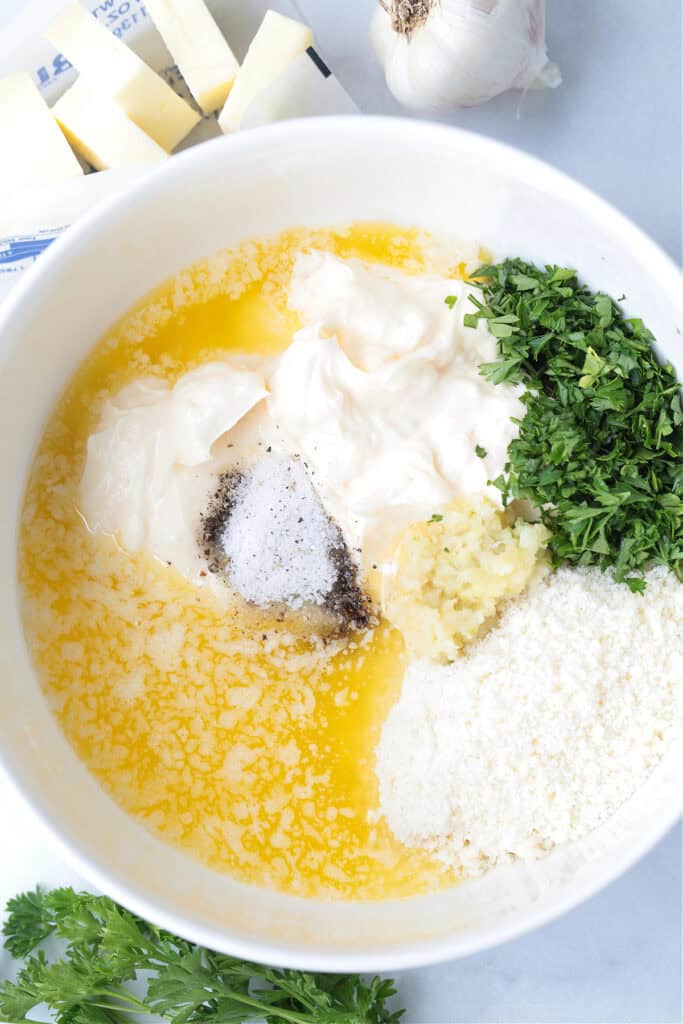 ingredients in a bowl for making parmesan garlic sauce