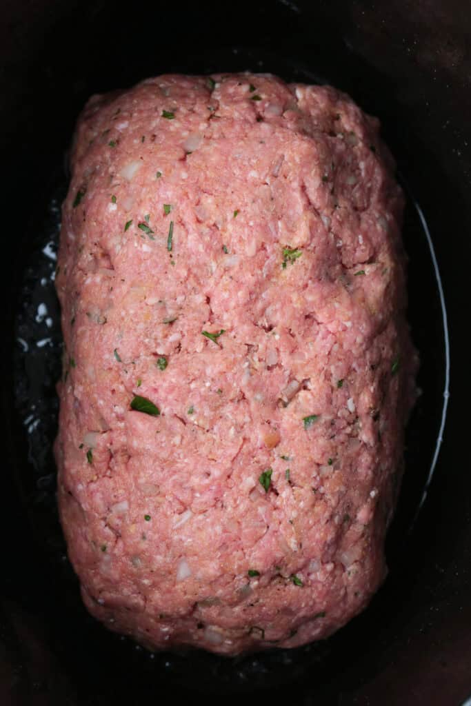 raw meatloaf in a slow cooker